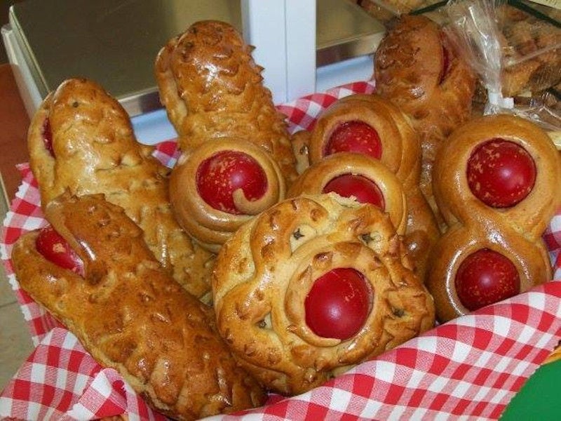 small breads with Easter eggs on the top at The Apolloniatisses workshop